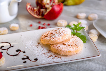 Close up view of beautiful elegant sweet dessert served on the plate. Beautiful decoration, restaurant dish, ready to eat. Tea time, cozy atmosphere.