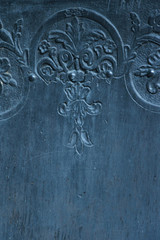 Close up view of beautiful manual engraving ornament on an antique wooden door
