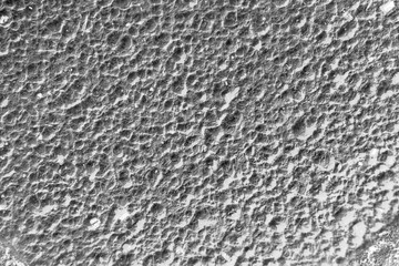 background, texture - the lunar surface, top view (in fact - wet clay with traces of rain drops)