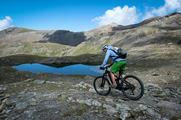Fototapeta na wymiar mountainbiker in action in the beautiful aosta valley, Italy, Europe