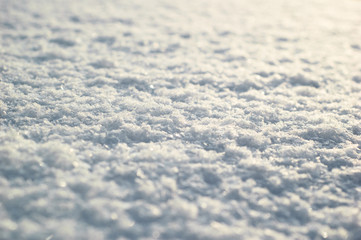 Snow surface close up. Fresh white snow texture.