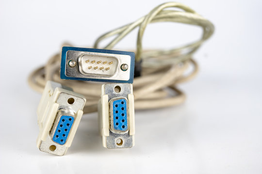 Old PC cables on a white table .. Com and lpt connectors for old computer stations.