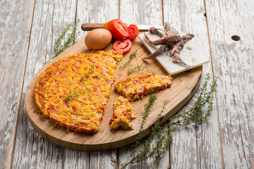 omelette with tomatoes anchovies and thymus