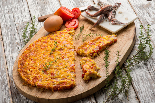 omelette with tomatoes anchovies and thymus