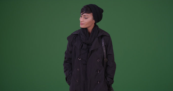 Fashionable Woman In Black Overcoat Smiling On Green Screen