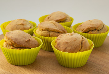 Banana muffins on a wooden board, natural light, close-up