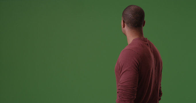 African American looking away from camera on green screen