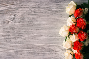 Roses on a wooden background
