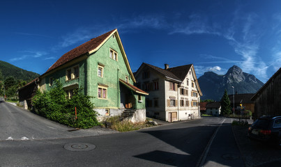 Fototapeta na wymiar Swiss village of Mels, Rhine Valley, with peak of Gonzen to the right