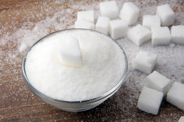 Various types of sugar, white sugar on wooden table.