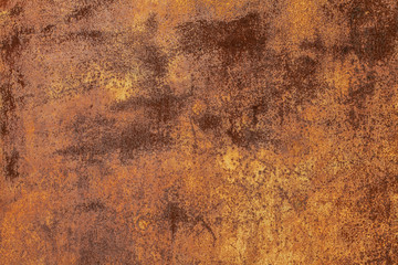 Rusty yellow-red textured metal surface. The texture of the metal sheet is prone to oxidation and corrosion. Textured Background in Grunge Style