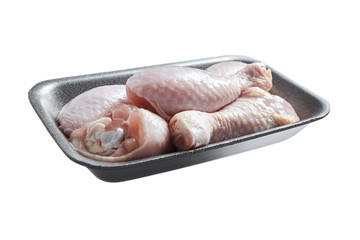 Raw and uncooked chicken legs with skin in a grey plastic container. Fresh meat of poultry in tray, isolated on white background