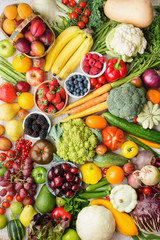 Healthy fruits vegetables berries background, cherries peaches strawberries cabbage broccoli cauliflower squash tomatoes carrots bananas beans beetroot, pepper, top view, vertical, selective focus