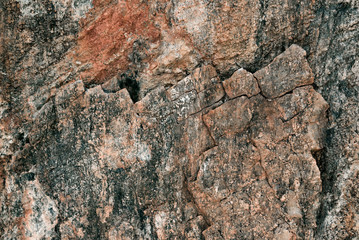 Background of natural stone. The texture of the stone. Untreated marble. Construction material.