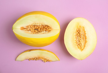 Flat lay composition with cut melon on color background
