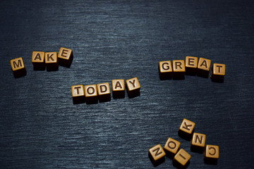 Make today great message written on wooden blocks. Motivation concepts. Cross processed image