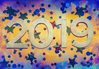  2019 on grunge coloured textured background with foil stars