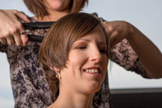 Young smiling woman at hairdresser