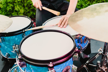 Fototapeta na wymiar set of drums being played by drummer