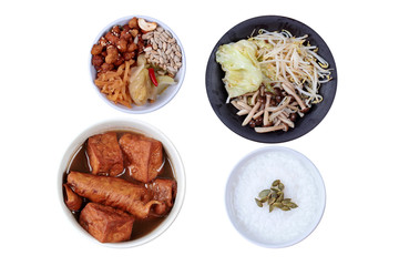 Chinese vegetable festival as rice gruel  fried tofu and fermented flour in brown soup and fried mixed vegetable served side dish.  (topped roasted pumpkin kernel and  fried mushroon, bean sprouts)