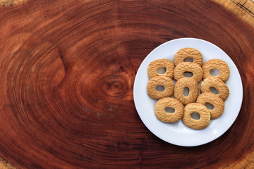 sweet biscuit on wood, space for text