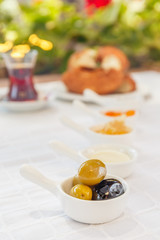Turkish tea, Honey, Jam,  Olives. Authentic turkish breakfast. Local cuisine concept