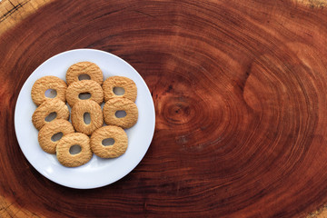 sweet biscuit on wood, space for text