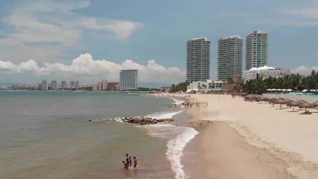 Aerial dolly zoom with panoramic view of Bah&iacute;a de Banderas in Puerto Vallarta, M&eacute;xico on a clear and sunny day.