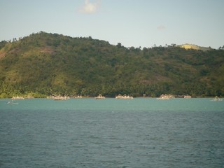 Fototapeta na wymiar Turquoise ocean, view on a tropical green island in Bali