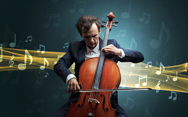 Young male musician playing on his cello with musical notes around © ra2 studio