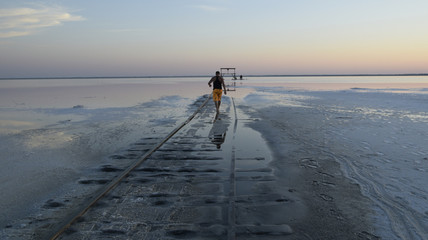 Walk on the salt lake Bursol at sunset.