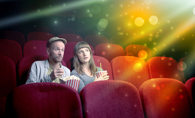 Fanciful couple watching miraculous part of a movie