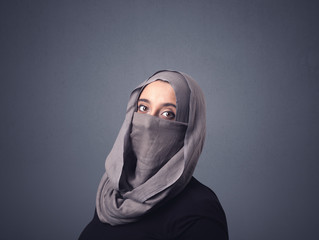 Young muslim woman wearing niqab 