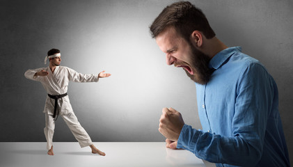 Giant hipster man yelling at a small karate man