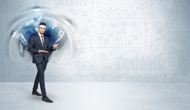 Young businessman in suit fighting with chart and report concept
