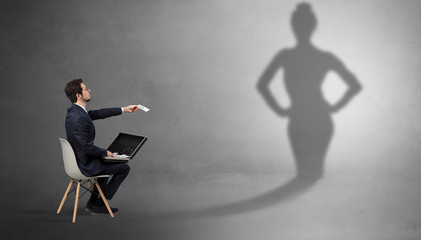 Rich businessman staying and offering stuffs to a pretty shadow woman
