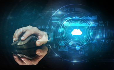 Hand using wireless mouse with cloud technology concept and dark background