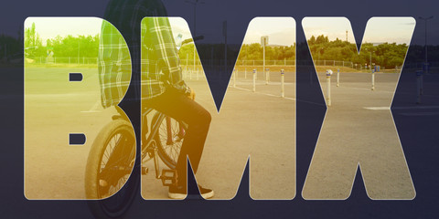 urban bmx text on top of man with bicycle background concept design a