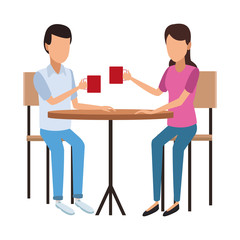 Couple drinking coffee on table