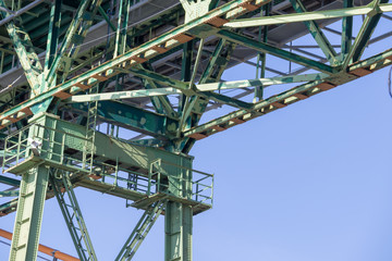 Halifax, closeup, bridge, steel, girders, metal, green, blue sky.