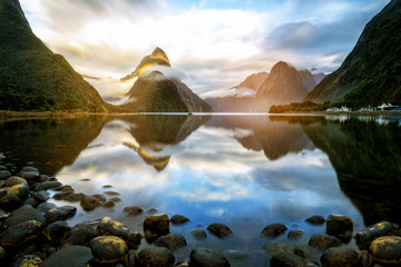 Beautiful Sunrise in Milford Sound, New Zealand - obrazy, fototapety, plakaty