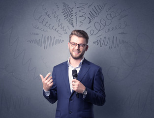 Businessman speaking into microphone with scribbles over his head 