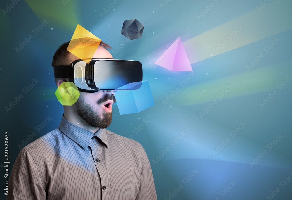 Poster amazed businessman with virtual reality colorful geometric shapes in front of him