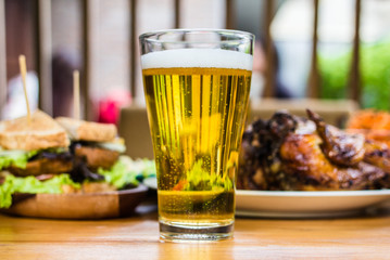  Beer. Dining Concept,With Chicken roasting,salad,French fries on wooden table