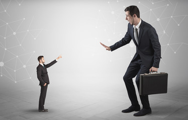 Small businessman aiming at a big businessman with connection and network concept
