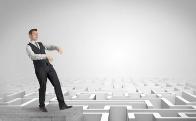 Zombi elegant businessman on the top of a labyrinth
