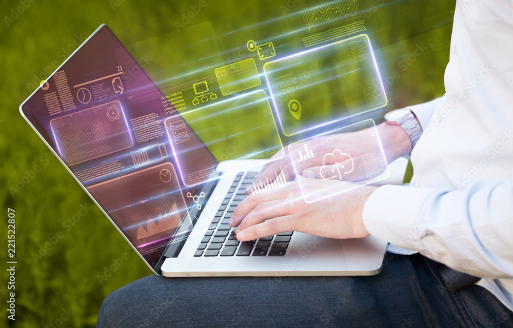 Aufkleber hand using laptop with database reports and online work concept