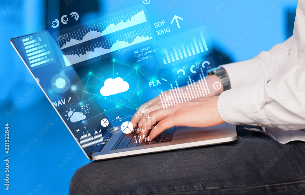 Aufkleber hand using laptop with cloud technology and linked information concept