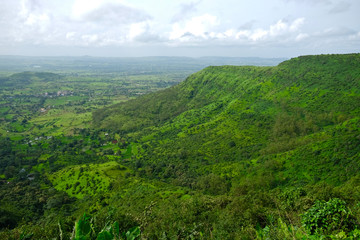 Beautiful landscape aerial, and closeup Photos of nature, roads, grass, trees, village, and farm land. Lush green monsoon nature mountains, hills, Purandar fort, Pune, Maharashtra, India