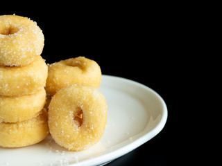 Sweet Sugar Donuts. black color background.